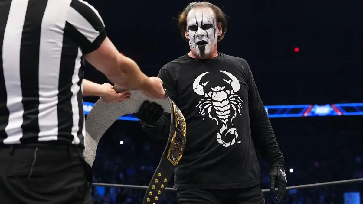 Sting February 2024 receiving tag team title belt.jpg
